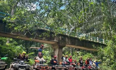 Komodo ATV Adventure ,Group crossing a river on ATVs during a Flores adventure tour ,East Indonesia cultural and adventure tours