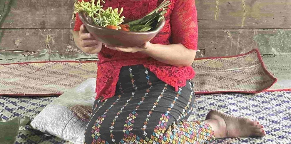 Traditional village kitchen setup in Flores, Indonesia with local cooking activity