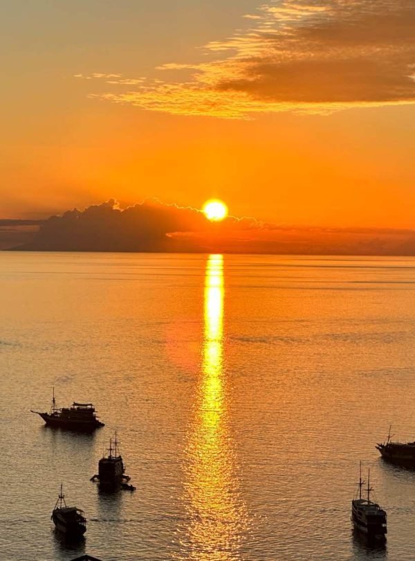 Golden sunset over the calm Flores Sea