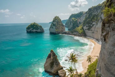 Tours 25 Pristine Indonesian beach with turquoise waters and palm-lined shores at sunset