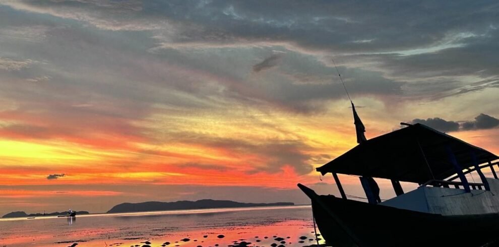Sunset Serenity: Fishing & Grilling at Rangko Village 2 Traditional boat at sunset on Rangko beach, West Flores