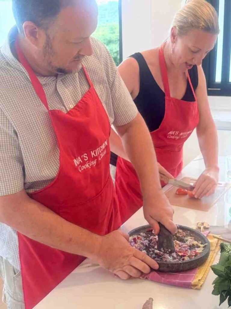 Couple preparing ingredients in a hands-on cooking class at Ina’s Kitchen Indonesia