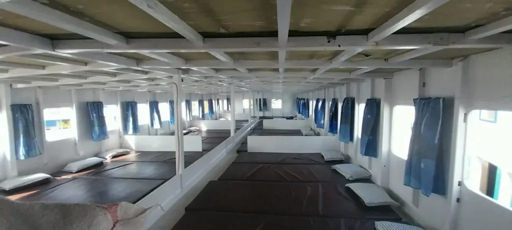 Comfortable interior of a budget liveaboard cruise boat in Komodo