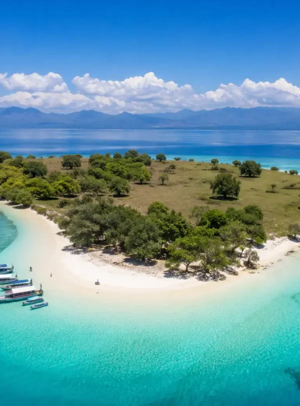 Aerial view of Gili Bedi Island with turquoise water and white sandy beach in Indonesia
