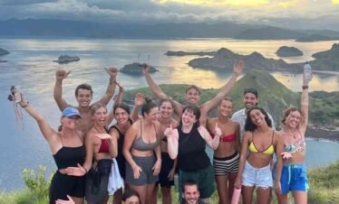 Travel group posing during a Komodo Island tour