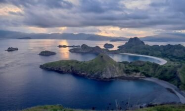 Aerial drone view of Komodo Island coastline and turquoise water
