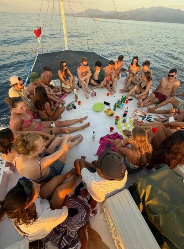 Guests enjoying sunset views on a luxury Komodo cruise
