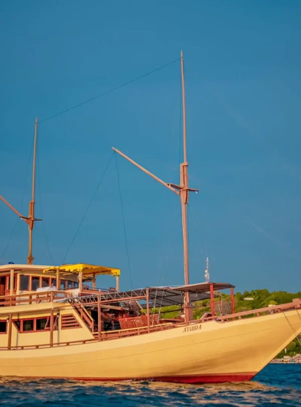 Luxury Athiira liveaboard cruise sailing through Komodo National Park waters