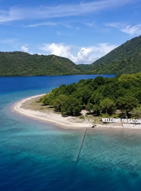 Aerial view of Satonda Island crater lake and tropical coastline in Indonesia