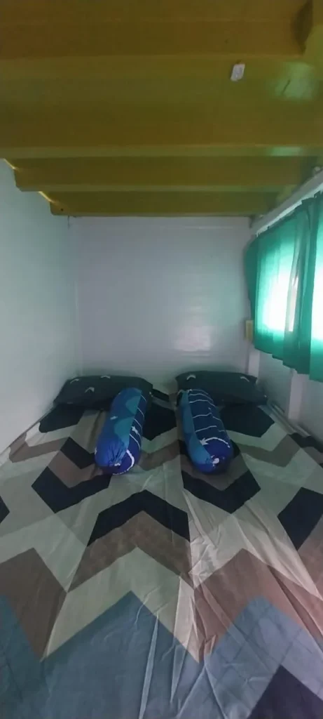 Shared lower deck cabin bed on a Komodo budget cruise