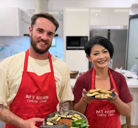 Ina's Cooking Class 7 Local cooking instructor and international guest proudly presenting homemade Indonesian dishes in Labuan Bajo.