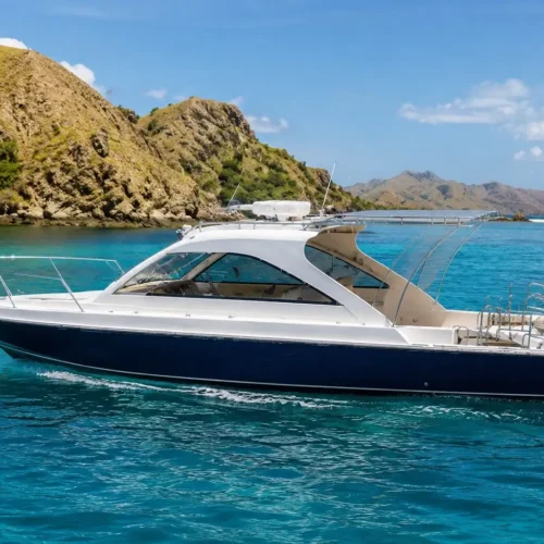 Premium private speedboat cruising through the turquoise waters near Labuan Bajo